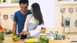 © Kittiphat - Young Asian Couple having fun Preparing Food, vegetable and salad in the Kitchen