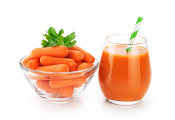 Bowl with baby carrots and a glass with fresh carrot juice isolated on white background.