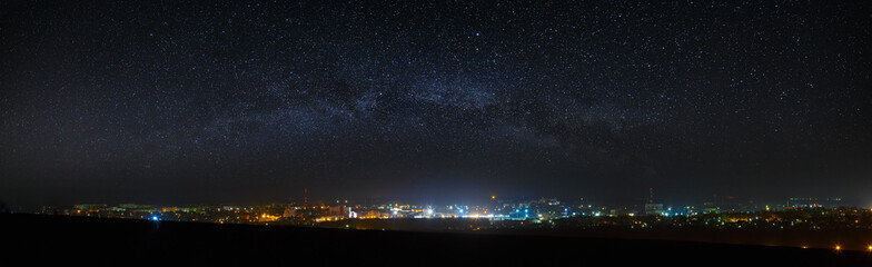 panoramic view of the starry night sky above the city.