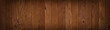 Dark texture wall of brown plank, background wooden surface,  panoramic view