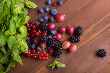 Wall Mural - Berries on a wooden background