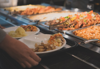 Stand with meat in the diner with self-service.