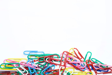 Colorful paperclips on white background.