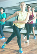 © JackF - Happy people learning zumba steps
