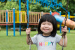 © Kenishirotie - Asian child on swing