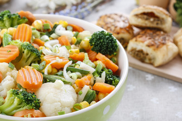 Sticker - Spring vegetable salad in green dotted bowl.