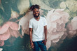 African American man with dreadlocks and a white T-shirt. Mock-up.