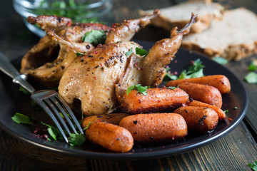 Canvas Print - Fried quail with carrots and fresh parsley