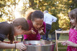 © Monkey Business - Three young girls apple bobbing at a backyard party