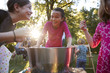 © Monkey Business - Three young girls have fun apple bobbing at a backyard party
