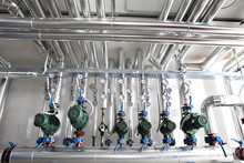 Pump , Manometer, Pipes And Faucet Valves Of Heating System In A Boiler Room
