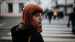 © Boris Jovanovic/Stocksy - Young redhead woman walking in the streets