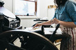 © CWP, LLC/Stocksy - Letterpress artist in her studio