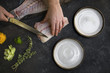 © Lior + Lone/Stocksy - Chef hands filleting raw fish for plating crudo dish