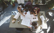© Lumina/Stocksy - Businesspeople Working With Technical Drawing