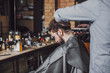 © Lumina/Stocksy - Man at Hairdresser's Salon