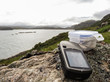 geocaching in scotland with gps device and cache container