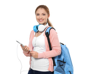 Poster - Teenage girl with backpack, headphones and tablet, isolated on white