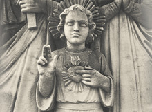 Detail Of Holy Family. Young Jesus With Sacred Heart. Statue Depicting Holy Family With Child Jesus Christ.