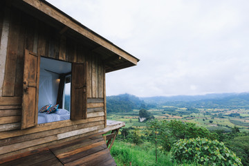 Wooden Homestay and beautiful mountains view in morning at Phu Langka National Park in Phayao Province, Thailand.