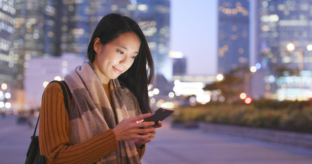 Canvas Print - Woman use of mobile phone at night