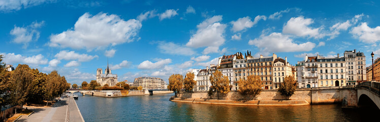 Fototapete - Paris, panorama over river Seine with Notre-Dame cathedral in Fall