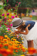 little beautiful girl in flowers park