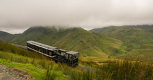 View From Mount Snowdon, Snowdonia, Gwynedd, Wales, UK - Looking North Towards Llyn Padarn And Llanberis, With The Snowdon Mountain Railway
