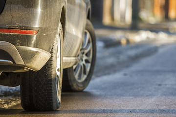 Close-up of dirty car parked on a side of the street