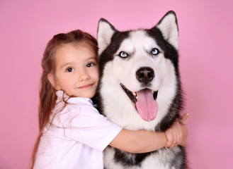 Sticker - Cute little girl with Husky dog on color background