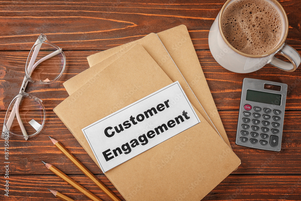 Sheet of paper with text SOCIAL ENGAGEMENT on notepads