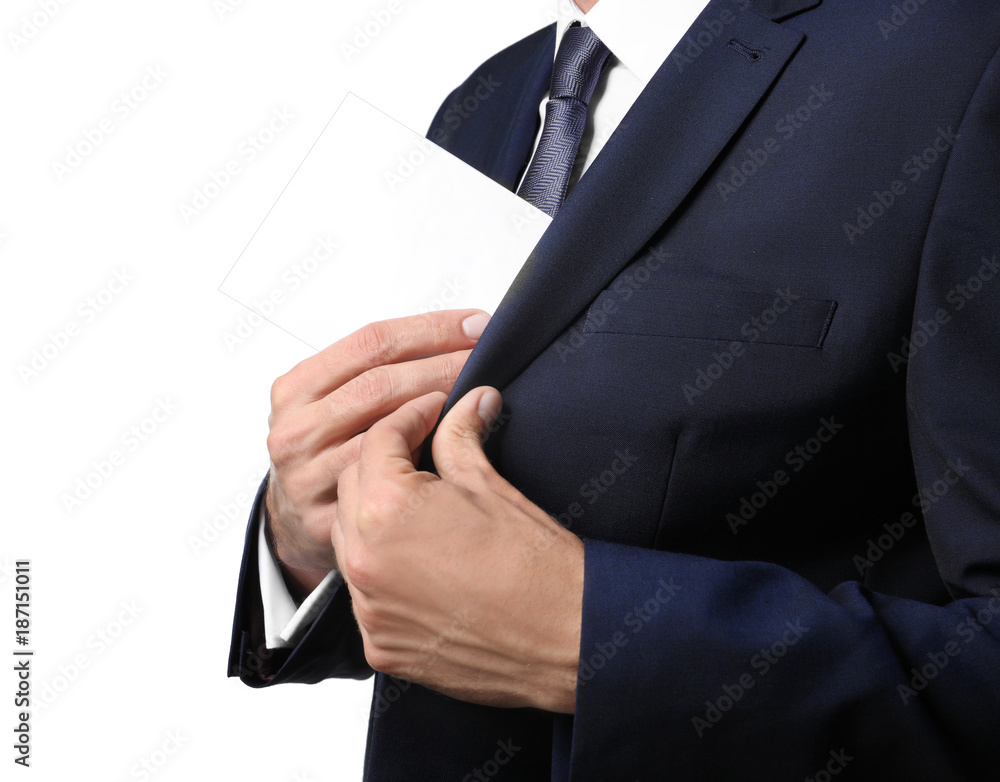 Businessman putting envelope with money in pocket on white background. Corruption concept