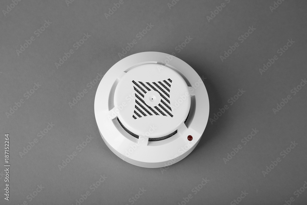 Smoke detector on grey background