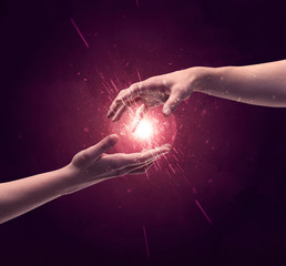 Wall Mural - Touching hands light up sparkle in space