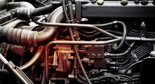 A Classic Fragment Of Diesel Car Engine Or Truck Engine With Copy Space For Text. Metallic Background Of The Internal Diesel Truck Engine Or Car Engine.