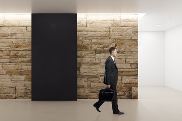 Wall Mural - Businessman with empty banner