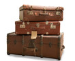 © Philipimage - three old suitcases isolated on white background