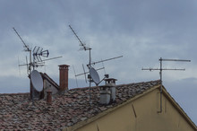 Lot Of Different Type Of Antennas On Roof Of A Building