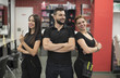 © FotoAndalucia - Three hairdressers posing in barber shop