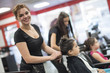 © FotoAndalucia - Hairdressers with little girls in beauty center saloon