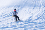 Fototapeta Tęcza - People are having fun in downhill skiing and snowboarding	