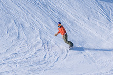 People Are Having Fun In Downhill Skiing And Snowboarding