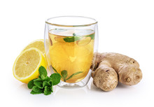 Hot Tea With Mint, Lemon And Ginger In A Glass With Double Walls Isolated On White Background.
