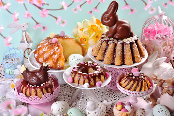 Wall Mural - assortment of various ring cakes for easter on festive table