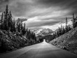 canvas print picture - Road leading to a big mountain in den canadian rockies