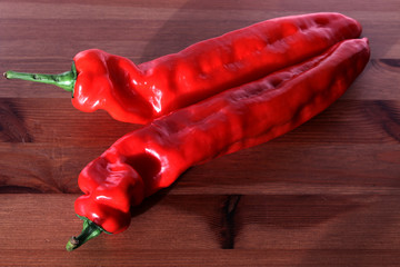 Wall Mural - Red peppers on a white background. Fresh vegetables on a white background. Composition from vegetables. Selective focus, free text space.