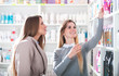 © leszekglasner - Customer woman choosing cosmetics with assistant in beauty store