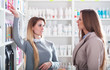 © leszekglasner - Customer woman choosing cosmetics with assistant in beauty store