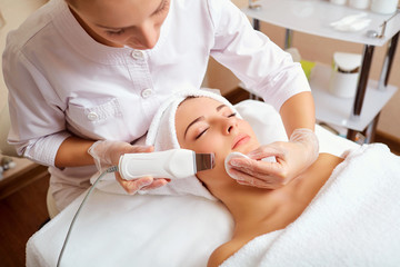 Wall Mural - woman on facial skincare procedure. hardware cosmetology.