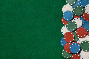 Wall Mural - Poker chips forming a border on the green game table.